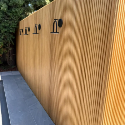 Close-up of Thermally Modified Ayous decking showing smooth grain and natural honey color