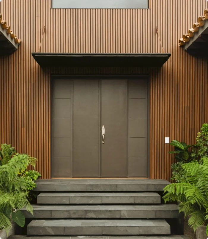 NewTechWood vertical composite siding around a modern home entrance